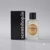 A bottle of Scentshop.io Achiever Essence Memory Scents next to its black packaging box with white vertical text, set against a neutral gray background.