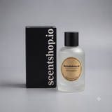 A frosted glass perfume bottle with a black cap stands next to a tall black box. The bottle has a round gold label reading 'Scentshop.